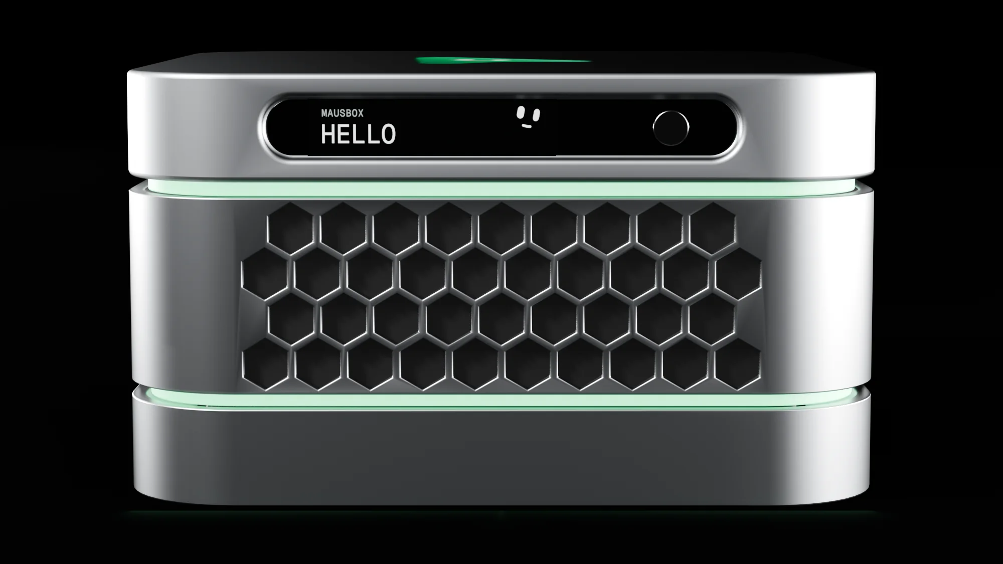 The MausBox head-on in the dark: three silver layers, hexagon vents, glowing green rings and the visor reading Hello