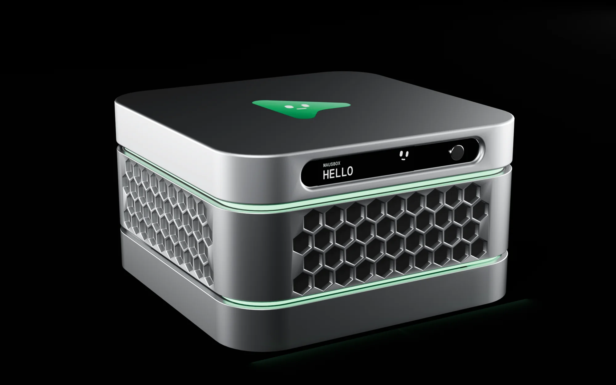 The MausBox at three quarters in the dark: silver layers, hexagon vents, green light rings and the green Maus on the lid